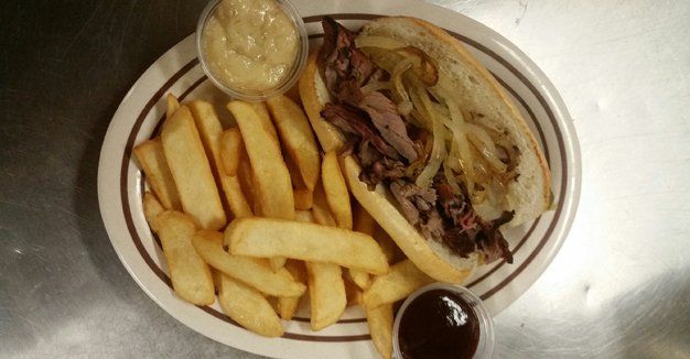 French dip sandwich with fries and au jus at 9th Street Pub in La Salle, IL